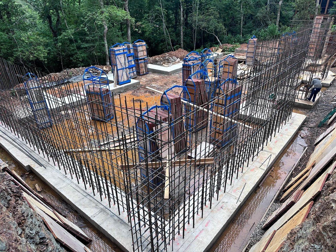 Rebar cages and wall forms for a deep poured foundation