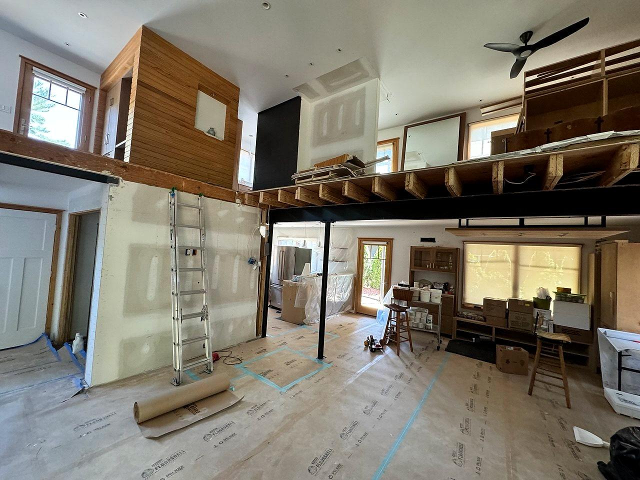 New loft level over the living space, drywall going up around the steel