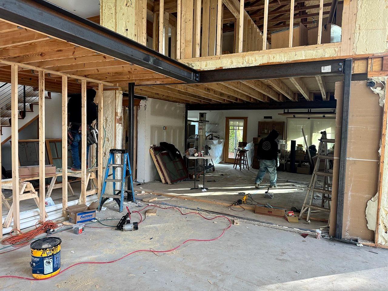 Structural steel beam and new framing opening up the ground floor of a downtown home
